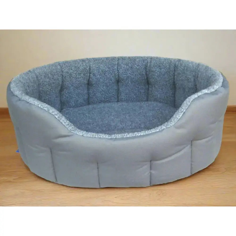 Gray premium oval bolster heavy duty fleece lined machine washable dog bed with soft textured interior and quilted exterior