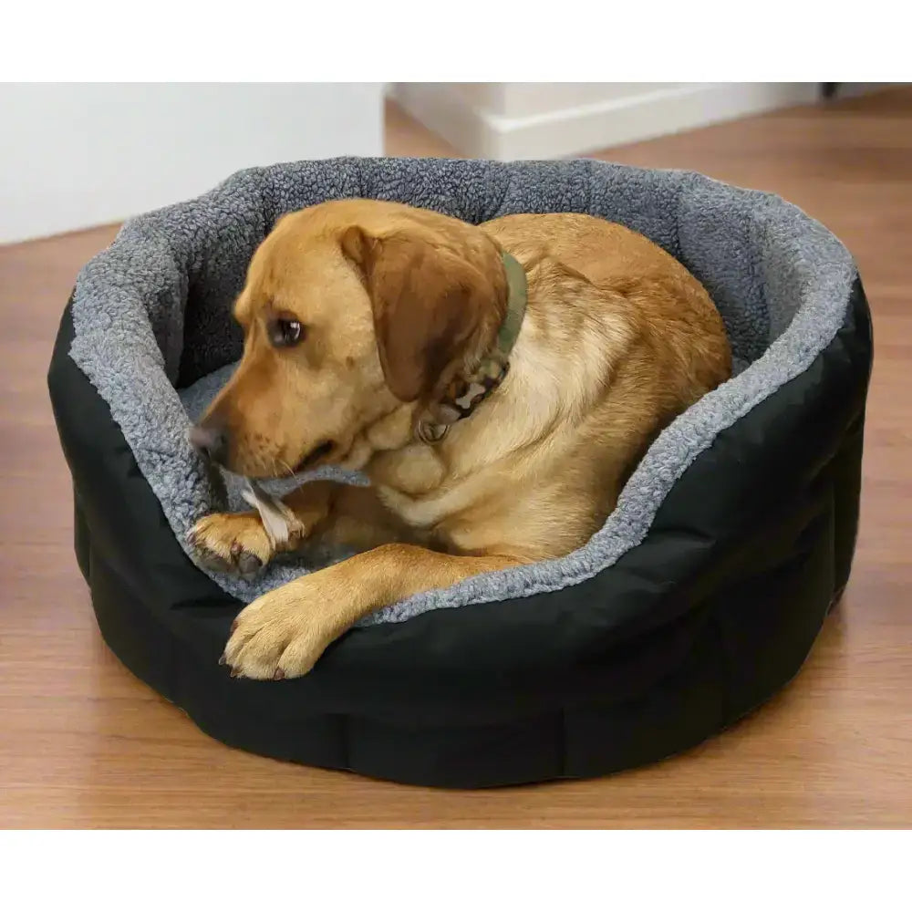 Black and gray premium oval bolster heavy duty fleece lined dog bed with soft sherpa interior, machine washable design