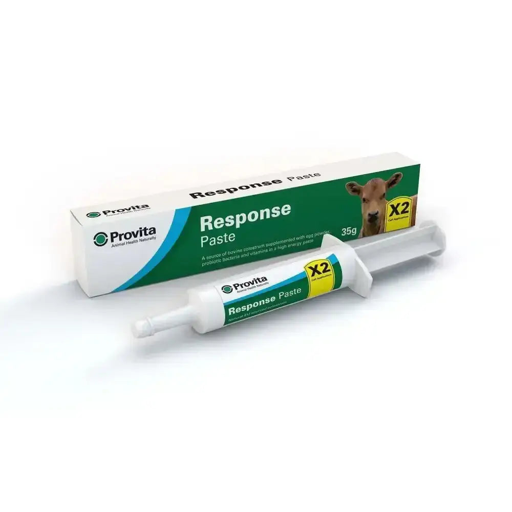 White plastic tube of provita response paste with green and yellow labels featuring a cow image for newborn calves orally administered paste