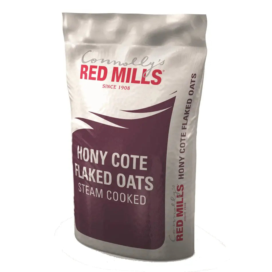 A white and maroon pouch of red mills hony cote flaked oats steam cooked for natural souroyal canine use 20 kg