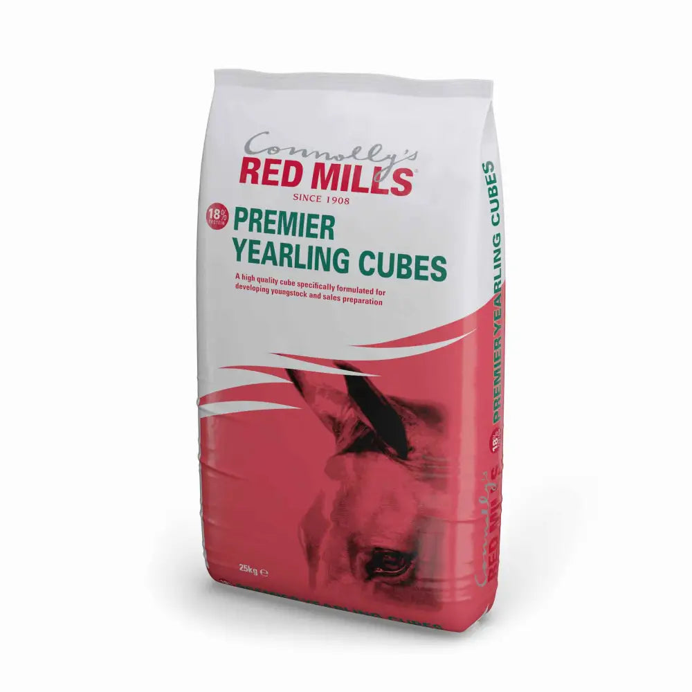 A white and red bag of connollys mills premier yearling cubes horse feed with a young horse for sales preparation