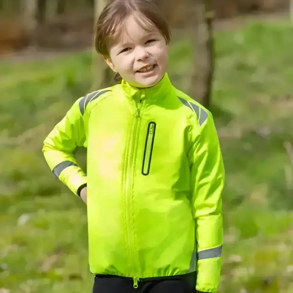 Bright neon green reflector children’s jacket by hy equestrian with reflective gray stripes for darker evenings wearing
