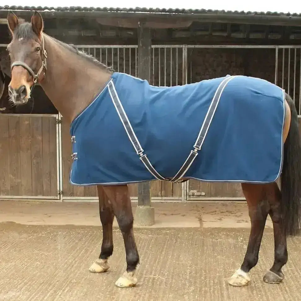 Blue horse blanket with white trim and black straps made from rhinegold comfey fleece anti-pill material rug