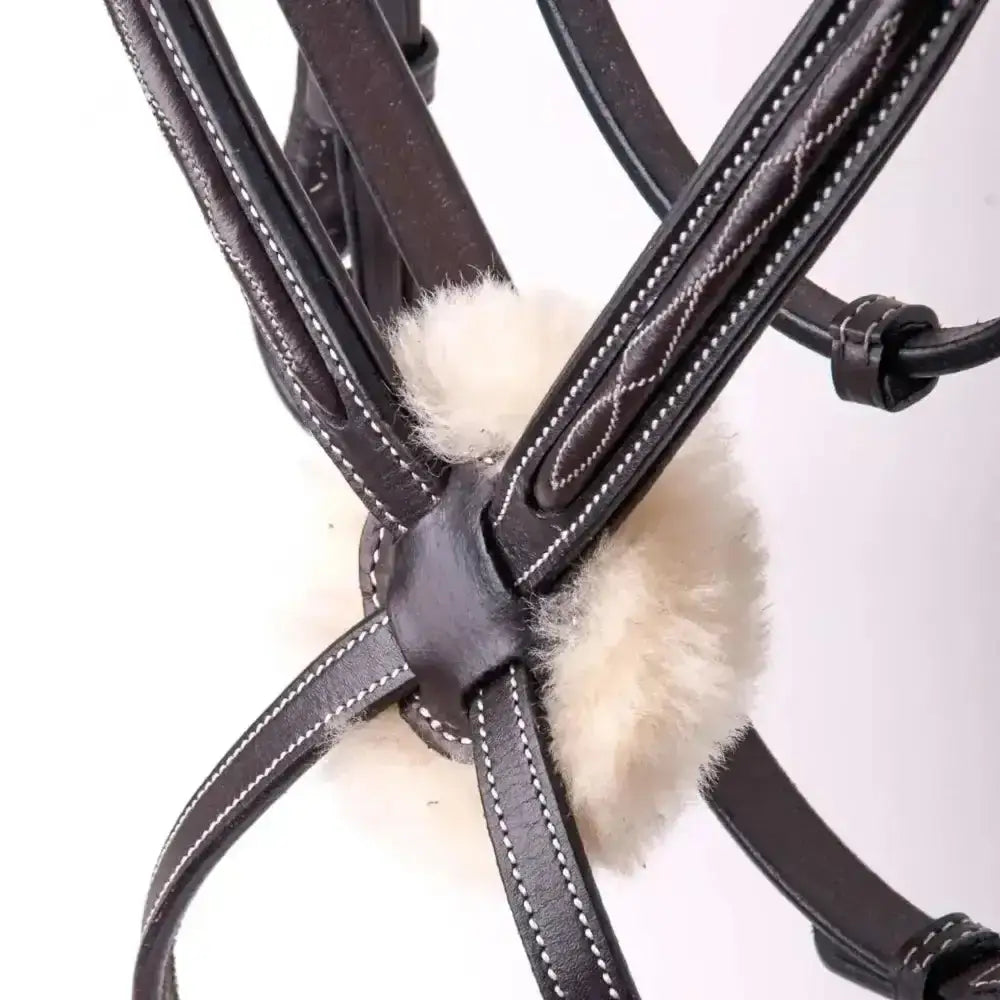 Black leather german leather bridle with white stitching and fluffy cream fleece padding and mexican style noseband