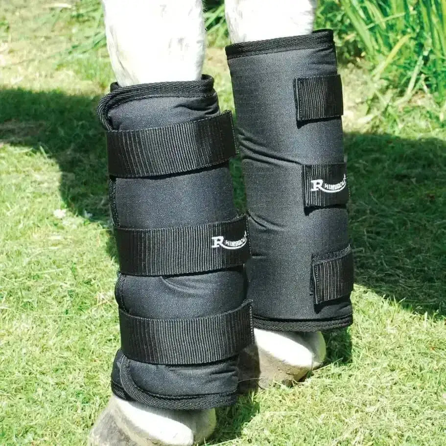 Black padded rhinegold elite half travel boots with adjustable touch tape fasten straps and rhinoceros logo