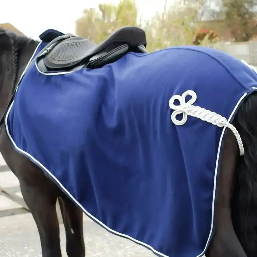Royal blue rhinegold embroidered fleece cutaway horse blanket with white piping and braided rope bow detail