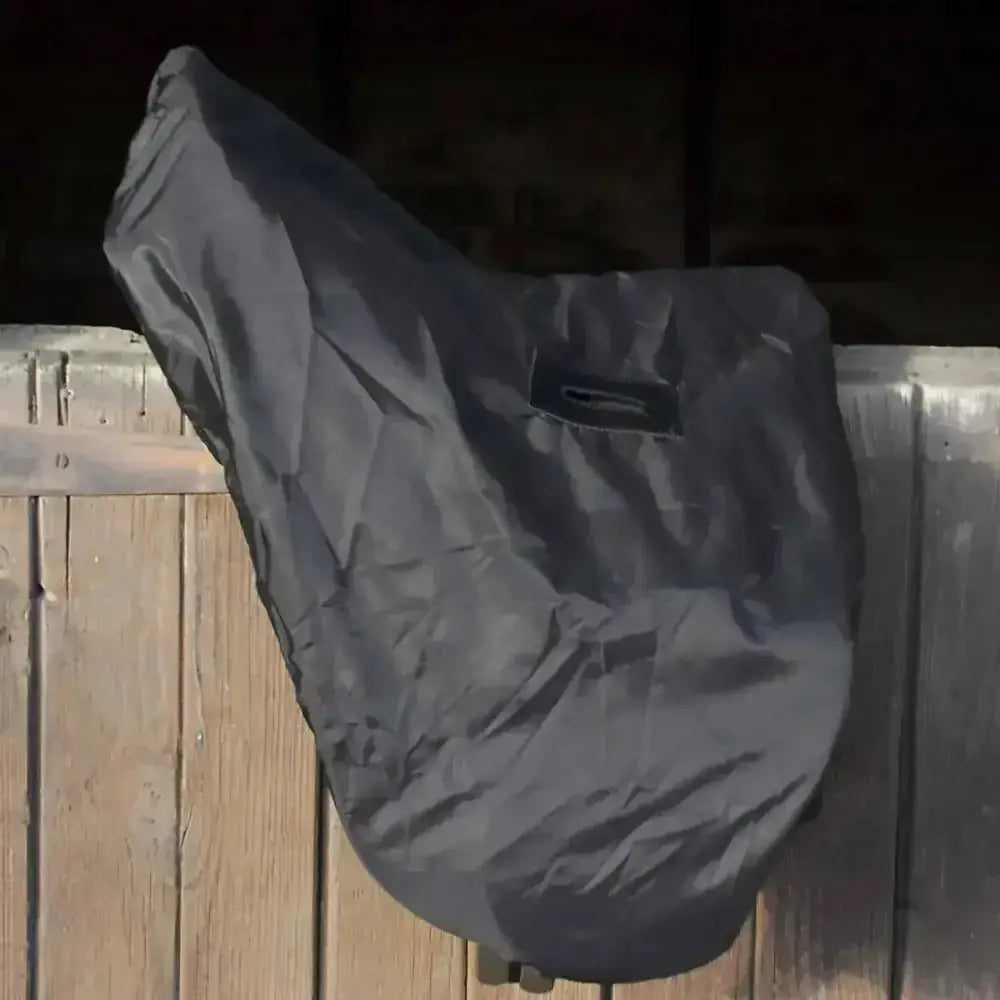 Dark gray rhinegold equestrian waterproof saddle cover made of durable fabric with slight wrinkles