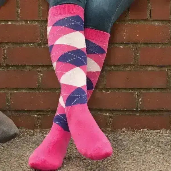 Bright pink rhinegold fully cushioned knee-high riding socks with navy blue and white argyle diamond patterns