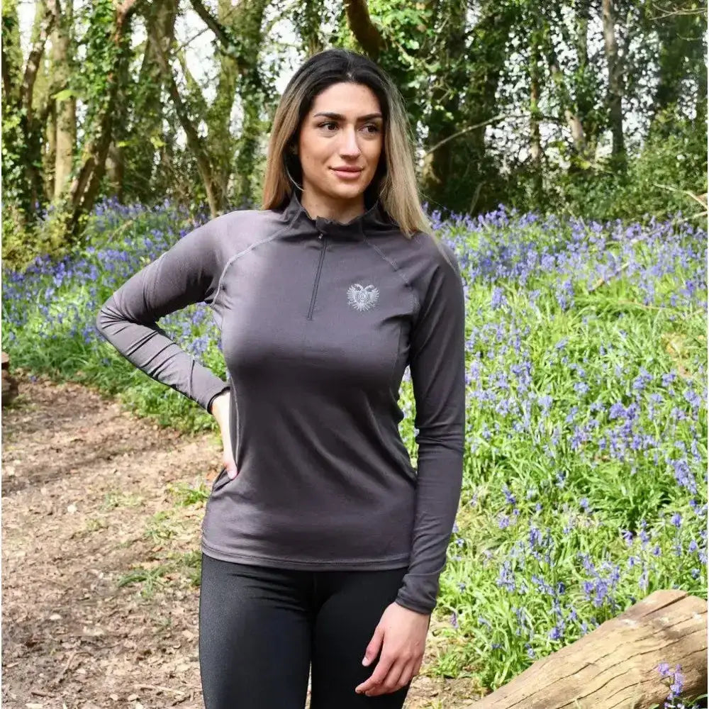 Dark gray rhinegold half zip athletic top with breathable stretch material and embroidered emblem on chest
