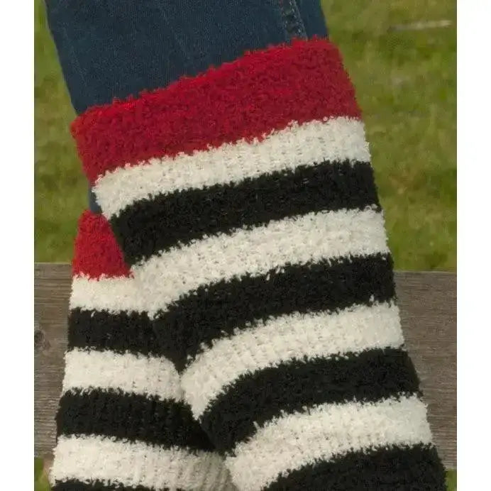 Rhinegold junior soft touch knee high socks in red black and white fuzzy stripes worn over blue jeans