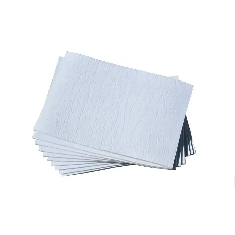 Stack of white textured rhinegold large gamgee pads made from soft layered cotton at barnstaple equestrian supplies