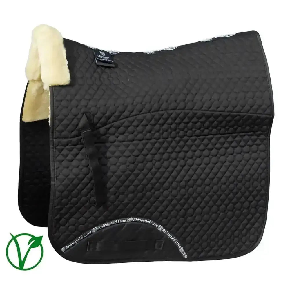 Black quilted dressage saddle cloth with cream fur lining and rhinegold luxe fur branding along the edge