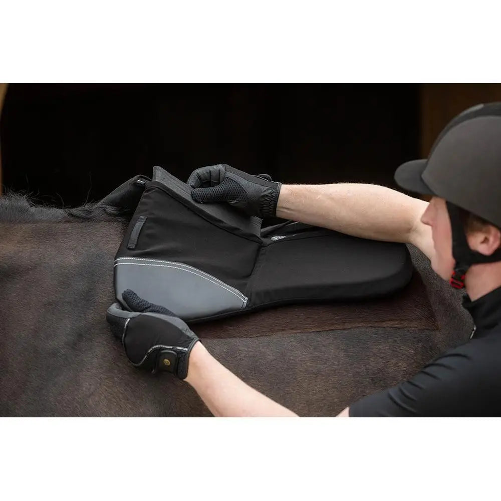 Black and gray rhinegold pro shock memory foam saddle pad with white stitching for shock absorber saddle use