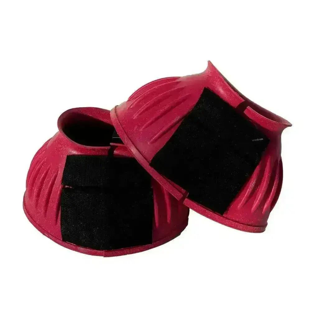 Vibrant pink rhinegold rubber reach boots with black velcro straps and ribbed texture for horses fetlock protection