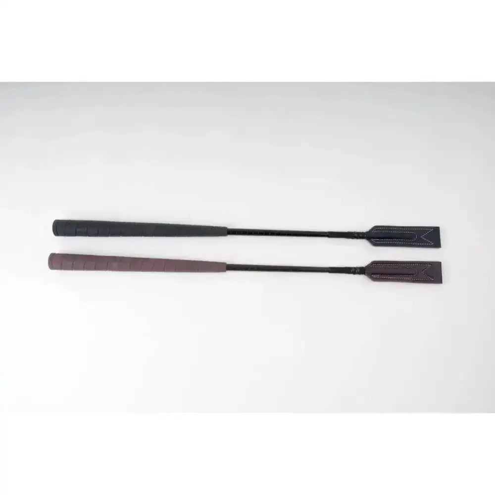Two black leather rhinegold show jumping crops with golf grip handle and stitched ends for jumping style baton use