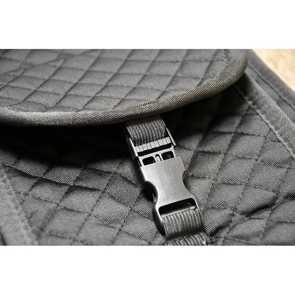 Dark gray quilted fabric with black plastic buckle and strap on rhinegold side pocket foam pad for shock absorption