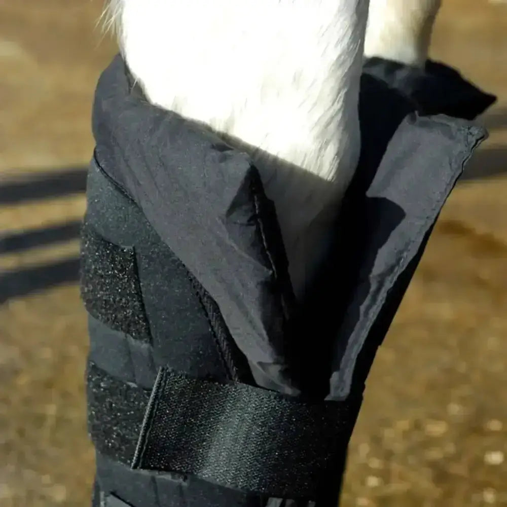 Black rhinegold stable medicine boots with detachable cotton padded liner and neoprene outer featuring velcro straps