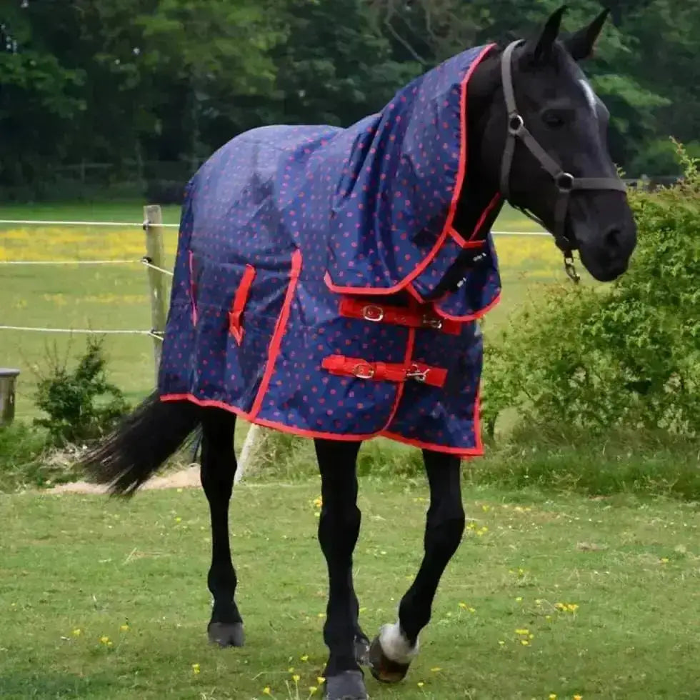 Navy blue rhinegold torrent lightweight turnout rug with red trim pink polka dots adjustable straps waterproof breathable outer