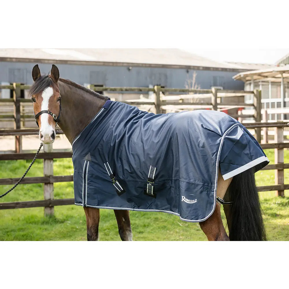 Navy blue rhinegold turnout rugs arizona 100g light waterproof horse blanket with white trim and reflective straps