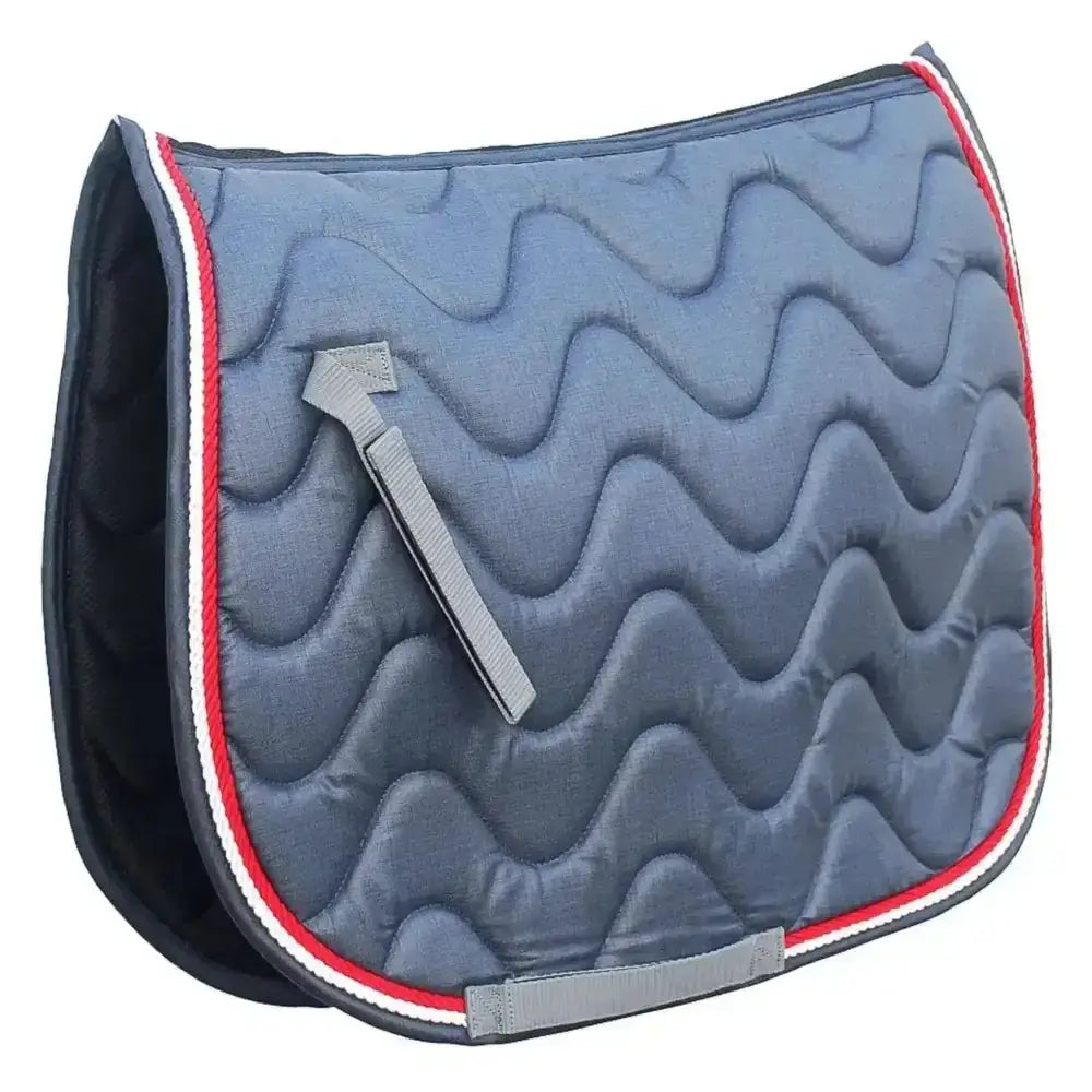 Blue quilted rhinegold wave saddle cloth with red and white trim made from wickable waffle fabric for horses