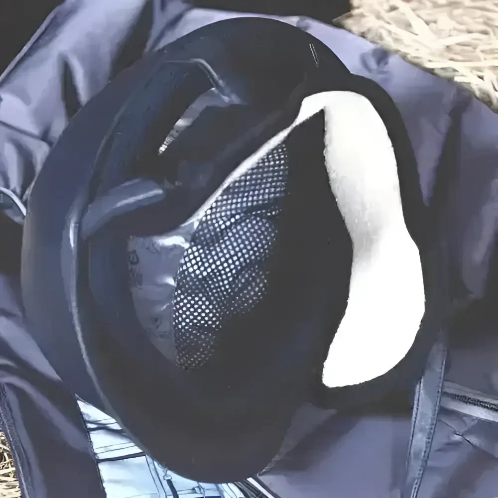 Black riding hat ear warmers with white padded interior and mesh ventilation panel for riding comfort
