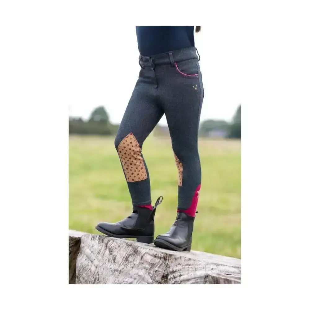Dark gray riding star collection denim jodhpurs with tan polka-dot knee patches and red trim along cuffs by little rider