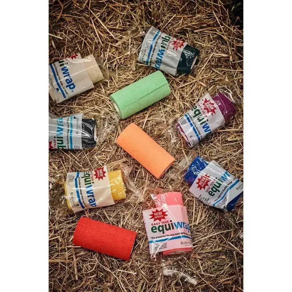 Colorful cohesive stretch bandage rolls in green orange pink and red from robinsons healthcare equiwrap 24 pack