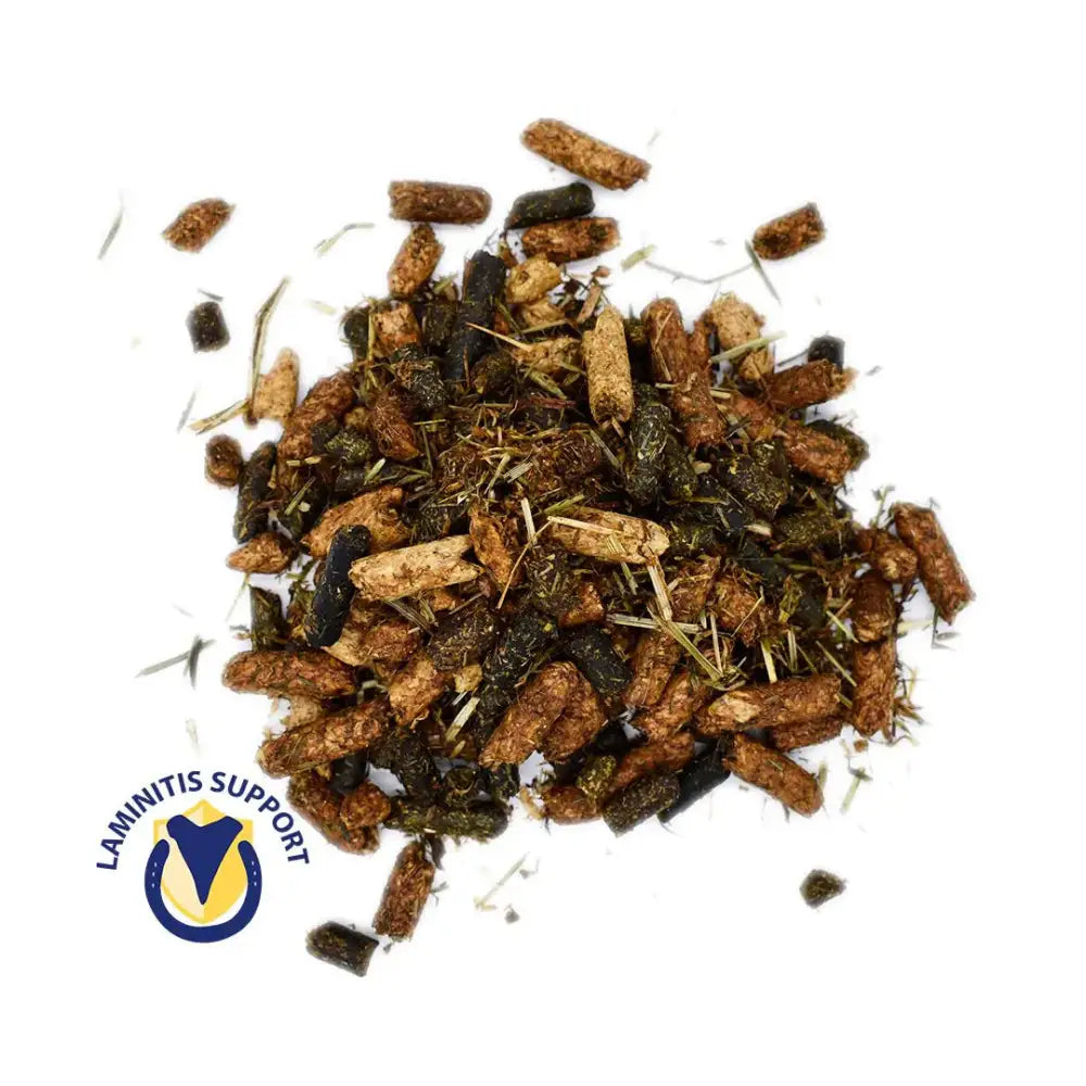 A pile of brown and black cereal free rowen barbary forage n fibre pellets mixed with hay for horse feed