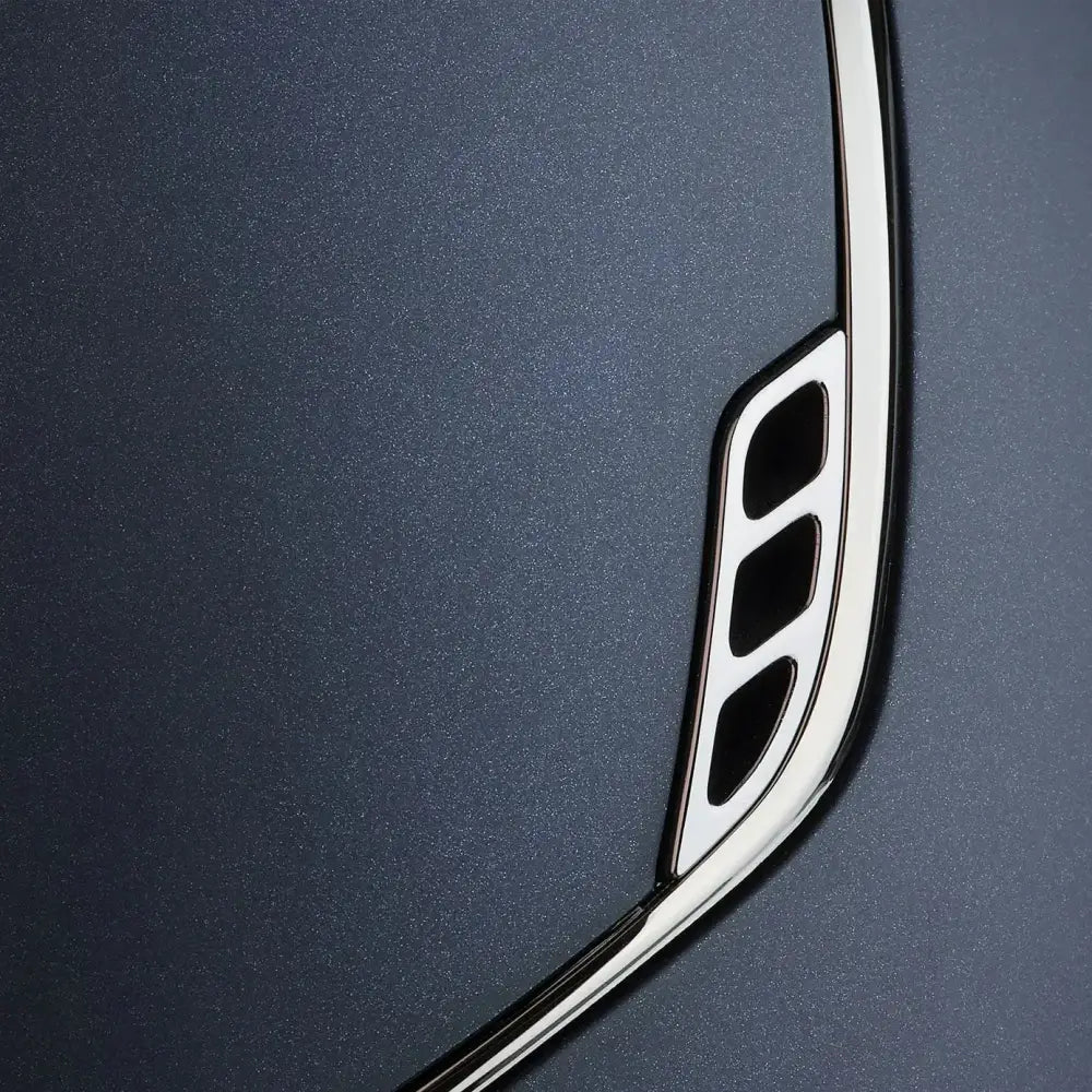 Chrome blazon trim with three vertical slits on matte navy samshield shadowmatt riding hat back side