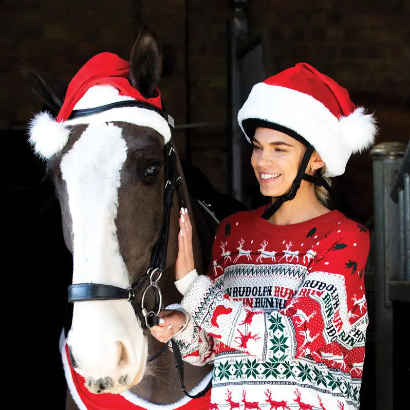 Festive red white and green santa hat horse bonnet by equetech with reindeer patterns and rudolph run text