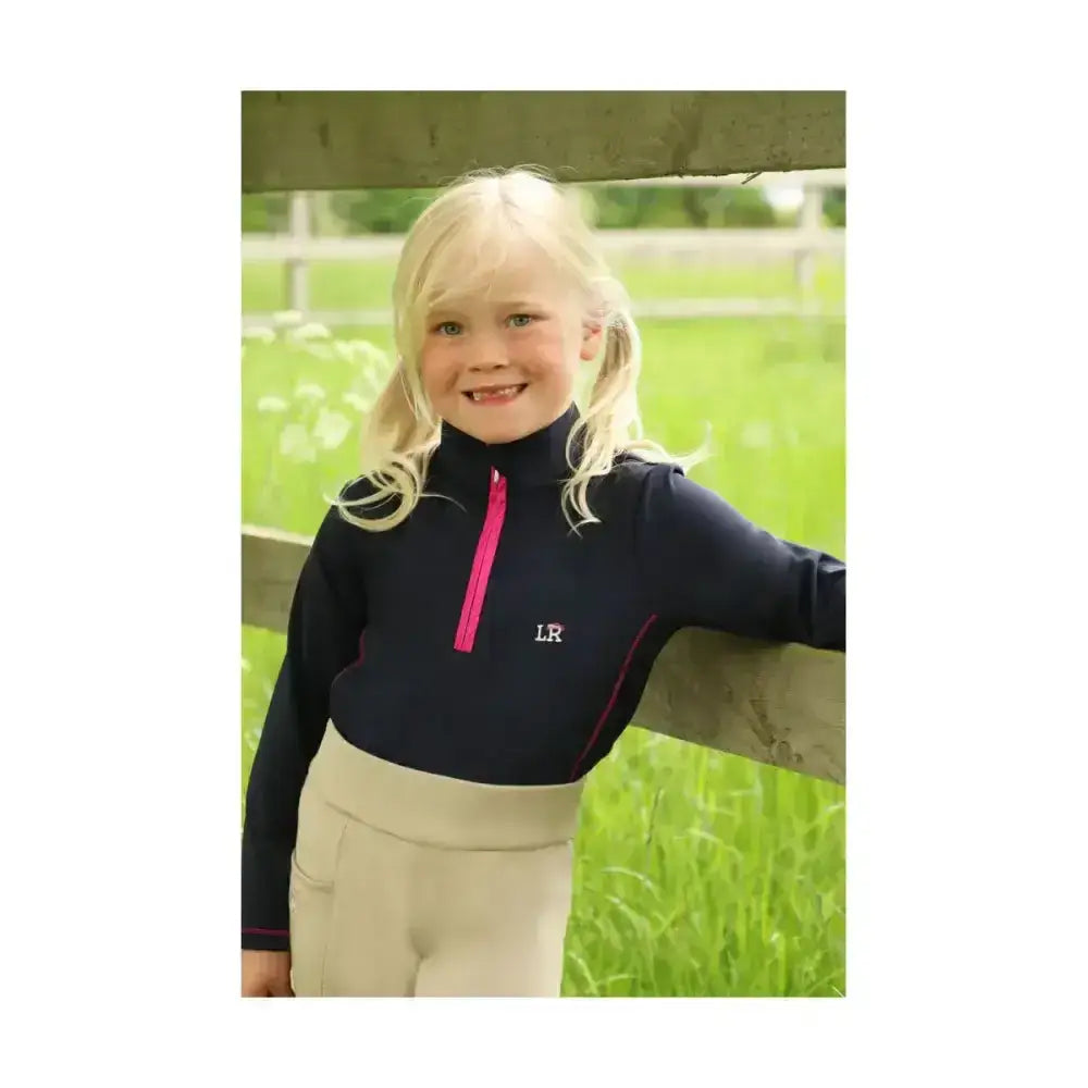 Navy blue sara base layer with bright pink half zip and trim featuring embroidered initials perfect for a child’s wardrobe base layers