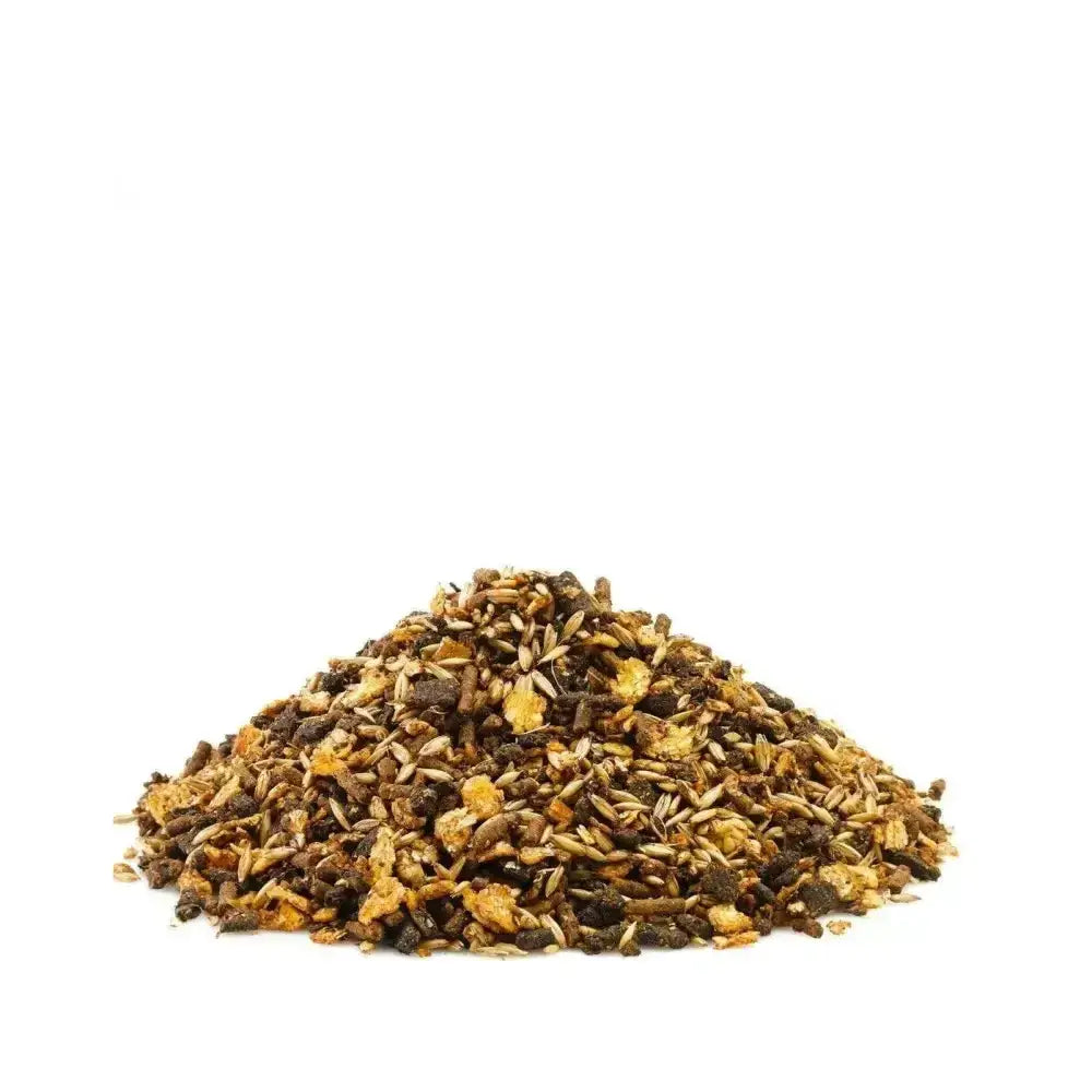A mound of mixed dark and light brown seeds and grains of saracen stud prep multipurpose sweetfeed with buffered mineral complex