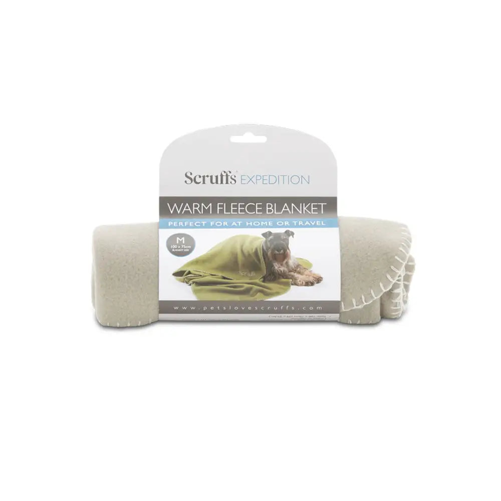 A beige soft scruffs expedition fleece blanket storm grey with stitched edges and a green dog image on the packaging