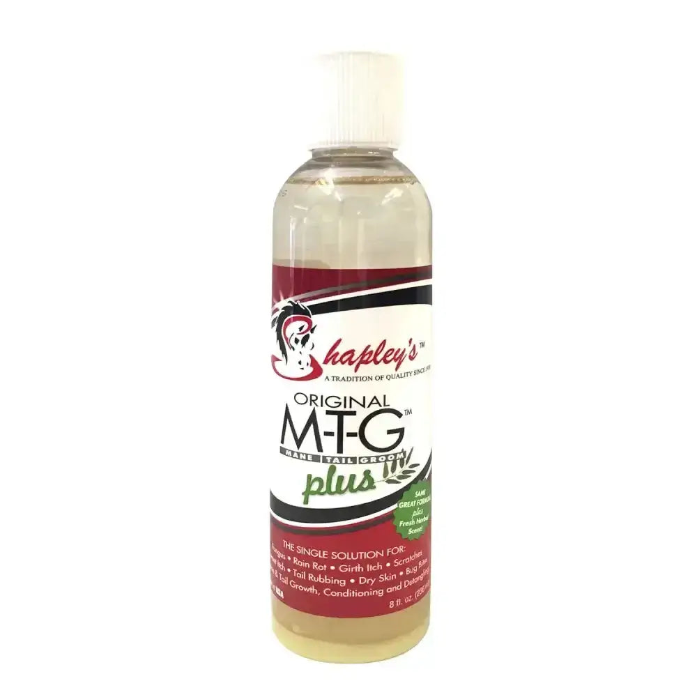 A clear plastic bottle with white cap labeled shapleys original m-t-g plus for mane tail groom and fungal skin problems
