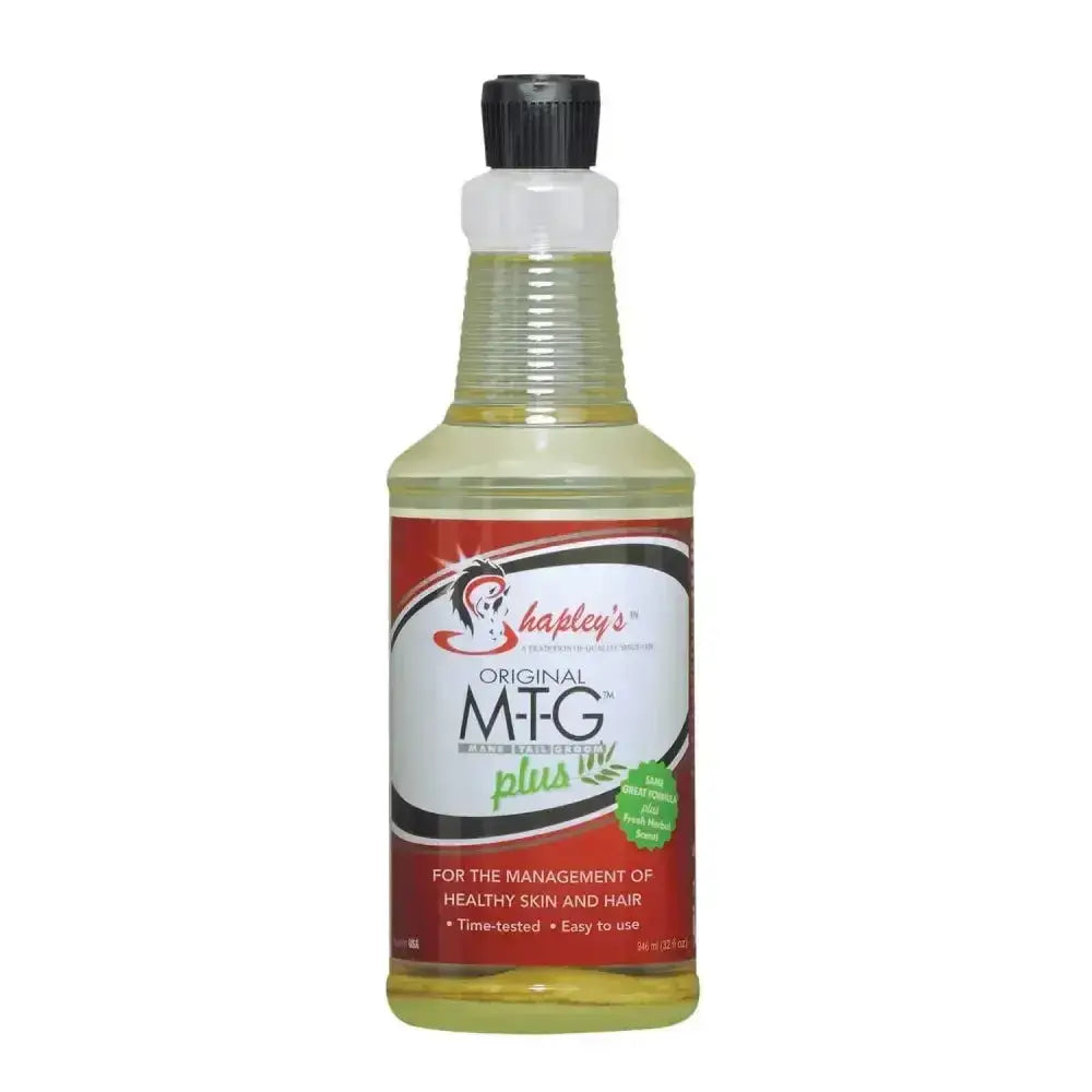 A clear plastic bottle with black cap contains pale yellow hapleys original m-t-g plus for mane tail groom and fungal skin problems