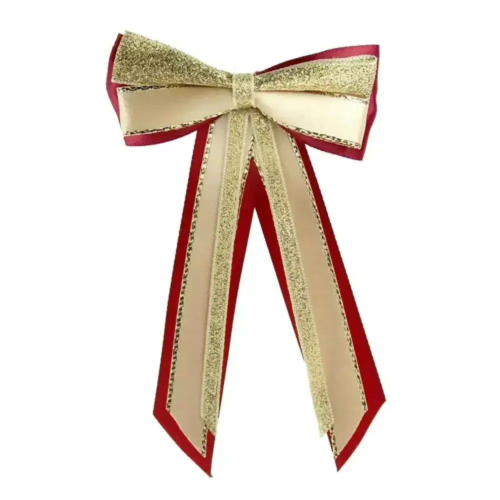 A festive red and gold glitter showquest hairbow with cream satin ribbon accents for a finishing showring touch
