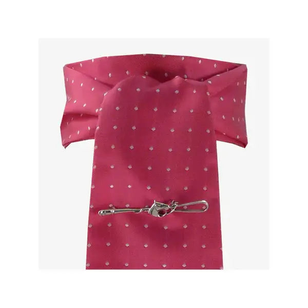 A pink polka dot tie with a silver tie clip featuring a red gemstone from showquest untied stocks pin spot
