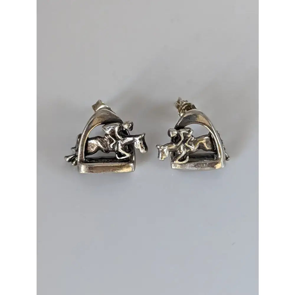 Silver steed stirrup stud earrings shaped like 3d jump horse and rider in shiny silver riding saddle design