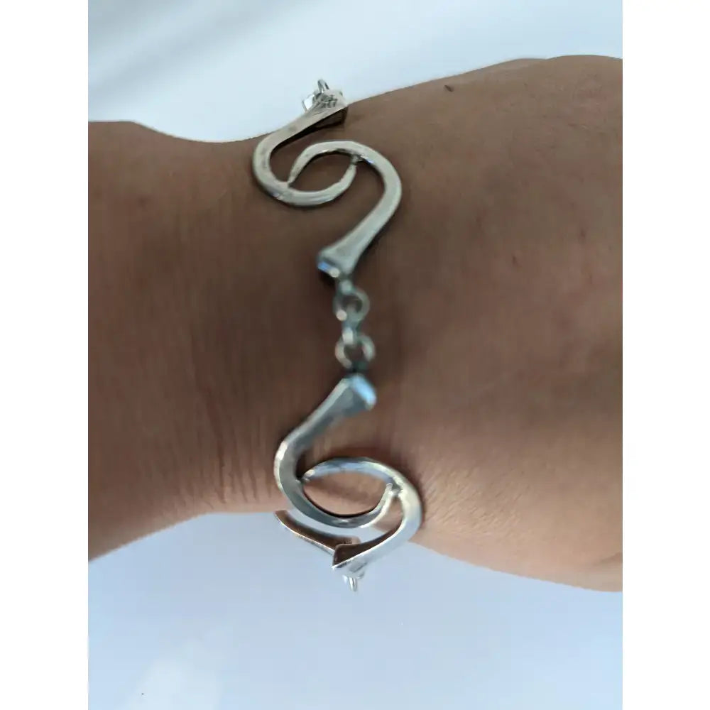 Silver steed sterling silver hoofnails bracelet with flowing sculptural curves and central chain link design