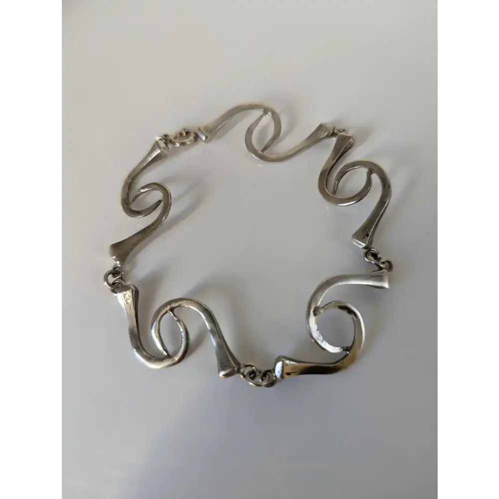 Silver steed sterling silver hoofnails bracelet with flowing sculptural links in a modern abstract design