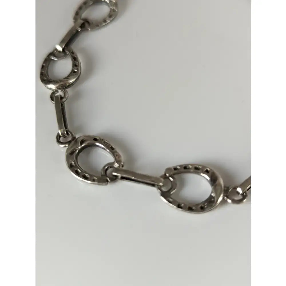 Silver steed horseshoe silver bracelet with silver horse hoof shaped link chain for a unique stylish look