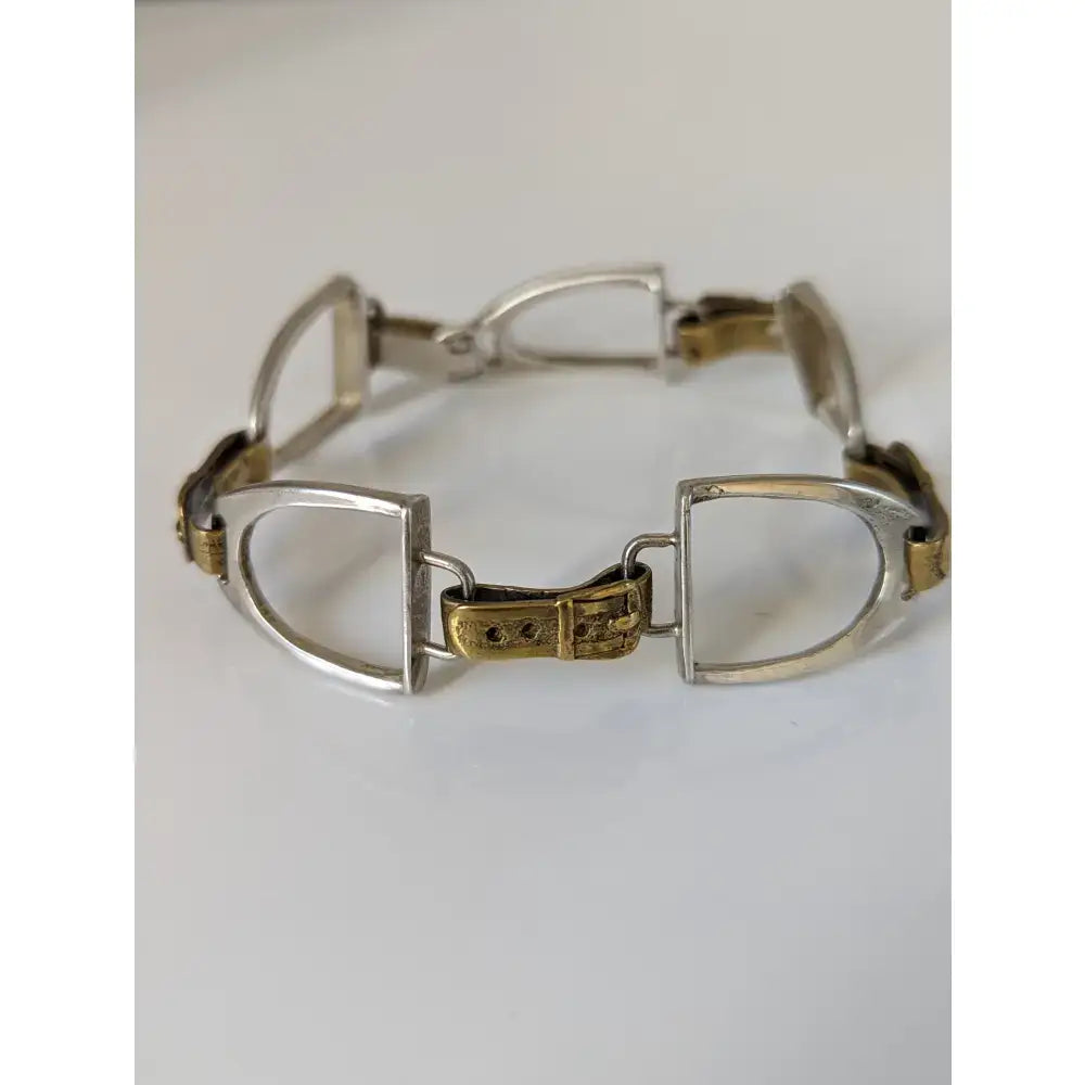 Silver steed stirrups bracelet with silver and gold toned horsebit style and ornate equestrian design buckle