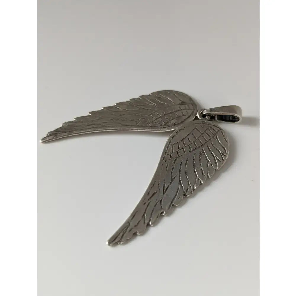 Silver steed angel wings silver pendant featuring detailed feather engraving and polished silver metallic finish