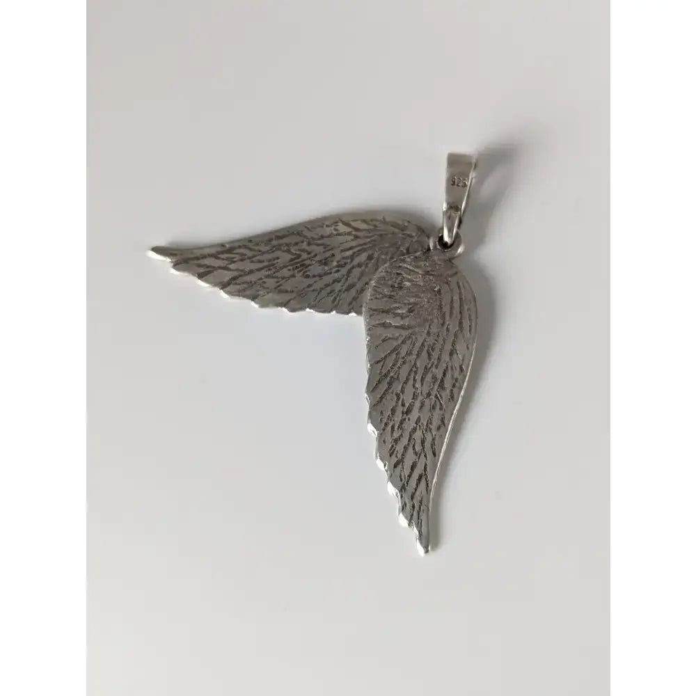 Silver steed angel wings silver pendant featuring detailed feather texture and polished silver metallic finish