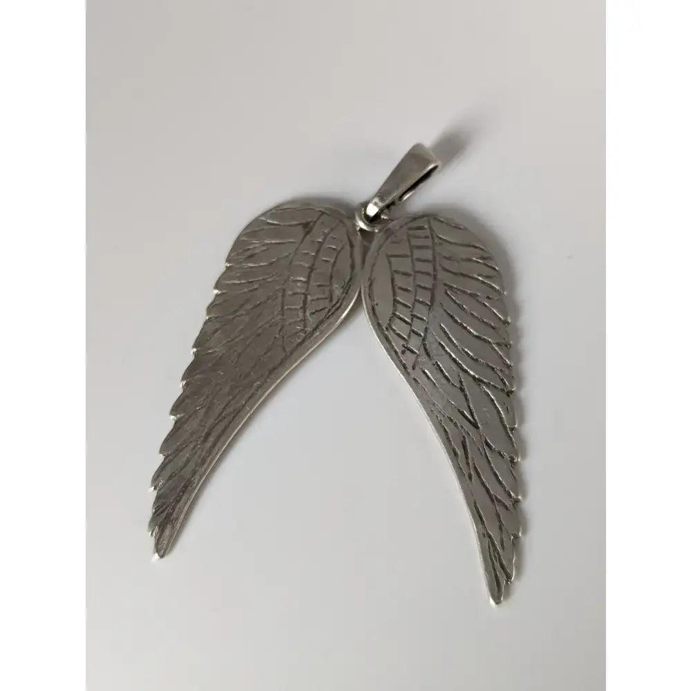 Silver steed angel wings silver pendant with detailed feather engraving and polished silver metallic finish