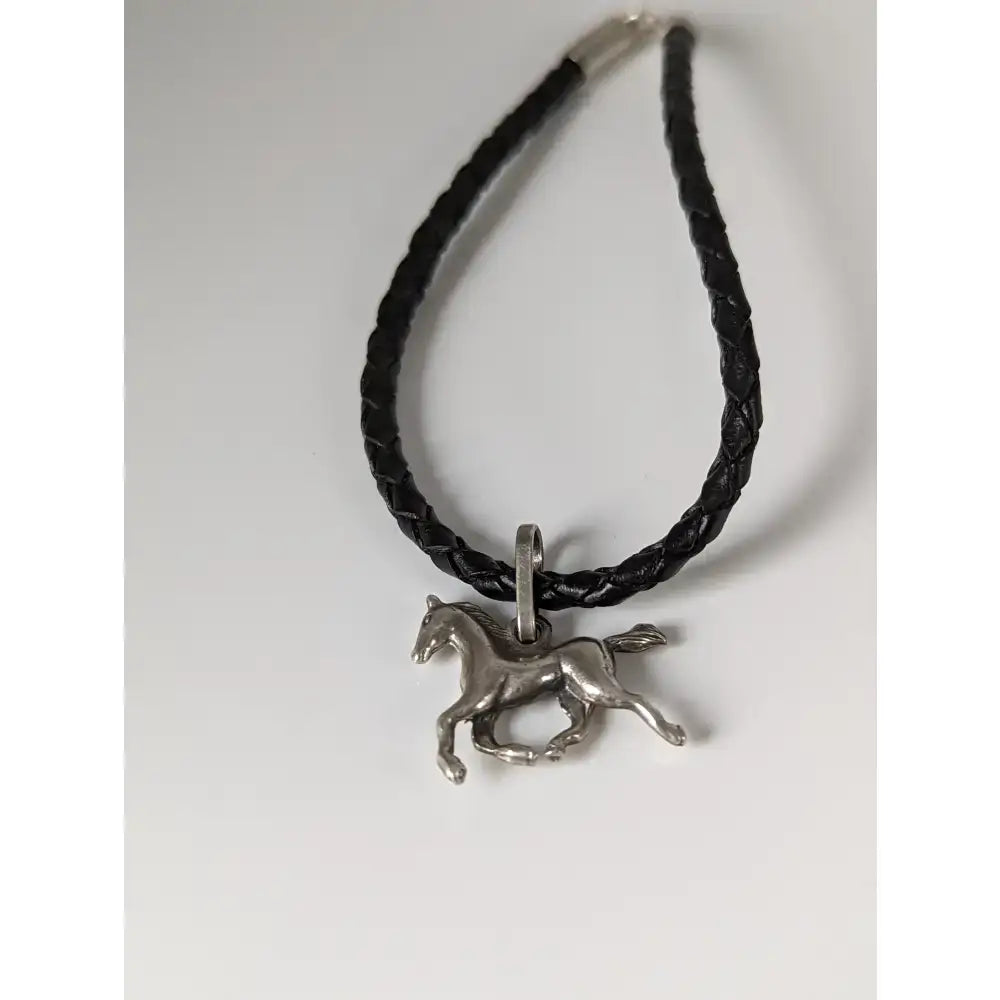Black braided leather cord bracelet with silver steed leather pendant featuring steed assorted charms