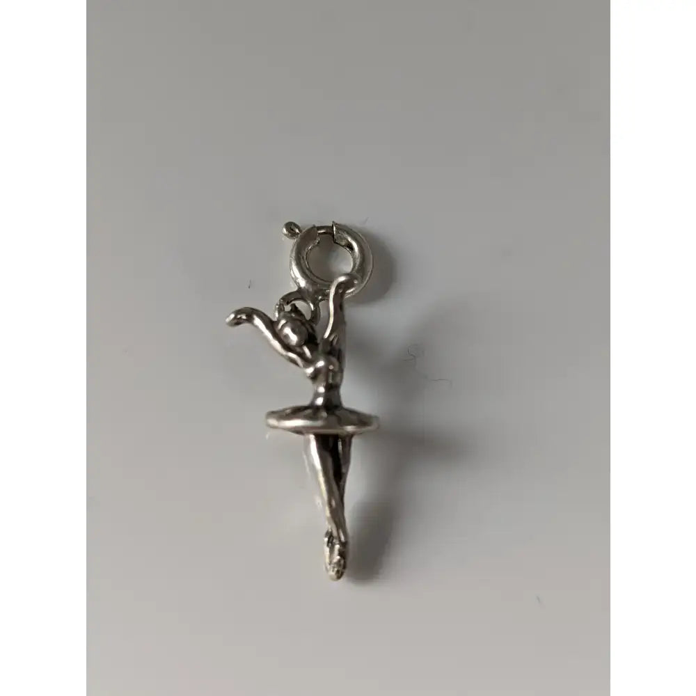 Silver steed ballet dancer silver charm in silver with delicate articulated pose and small loop for attachment