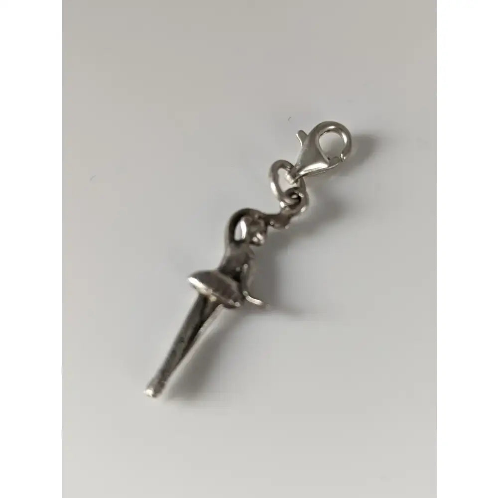 Silver charm featuring a silver steed ballet dancer design with a clasp perfect for jewelry collections