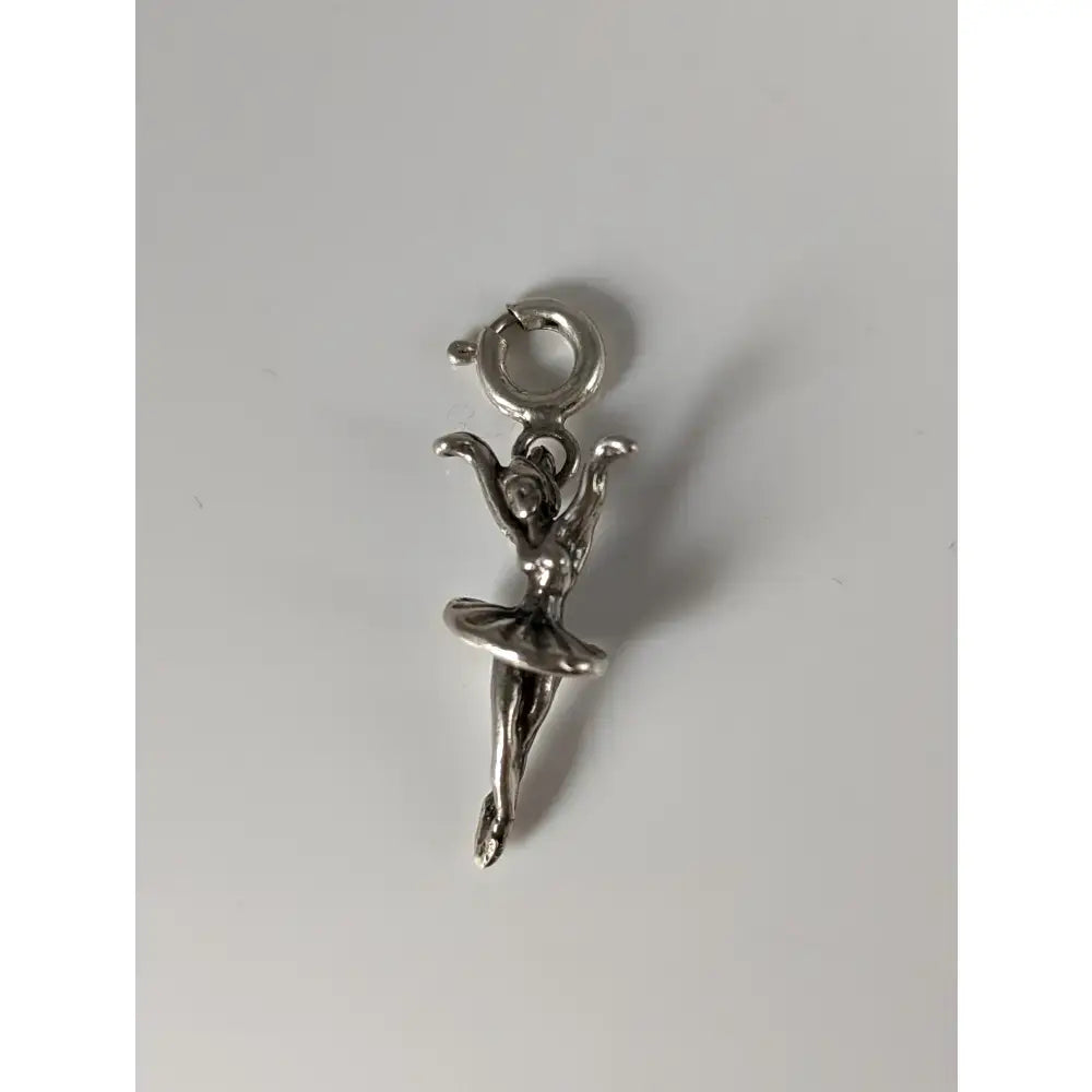 Silver steed ballet dancer silver charm featuring a polished silver charm with a delicate articulated pose