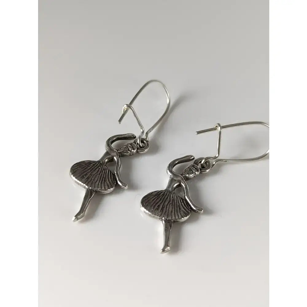 Silver steed ballet dancer dropped earrings in silver with detailed tutu and articulated limbs handmade silver earrings